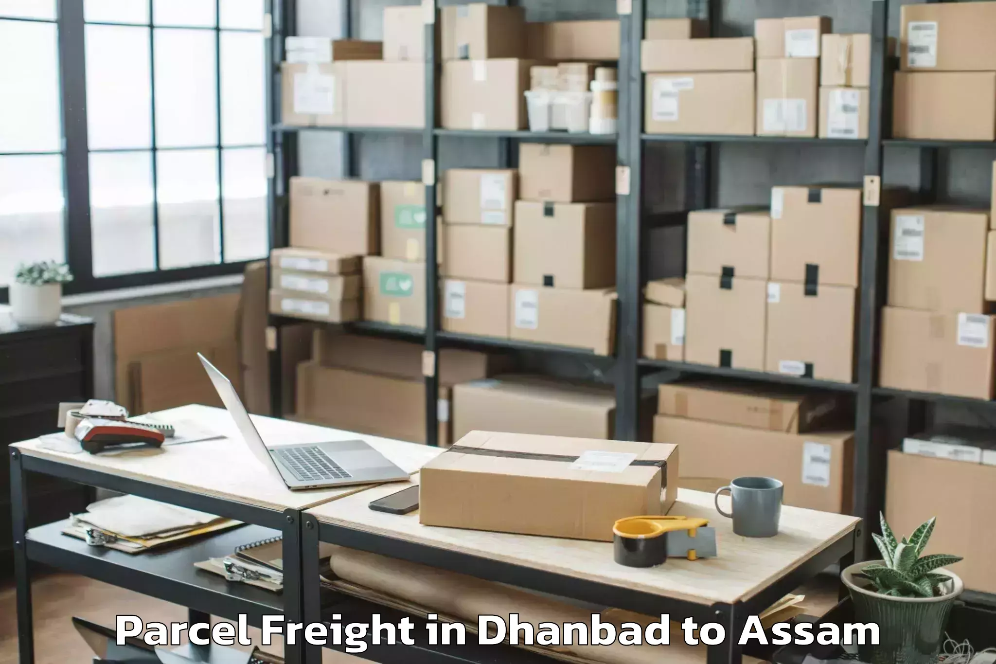 Book Dhanbad to Soalkuchi Parcel Freight